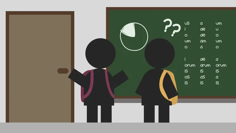Two students standing in front of a blackboard.